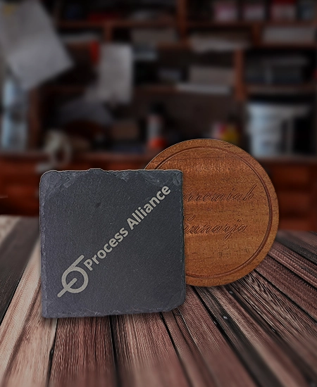 Two coasters, one stone and one wood
